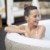 Frau entspannt sich im Bestway® LAY-Z-SPA® WLAN-Whirlpool Madrid AirJet™ Ø 180 x 66 cm, rund